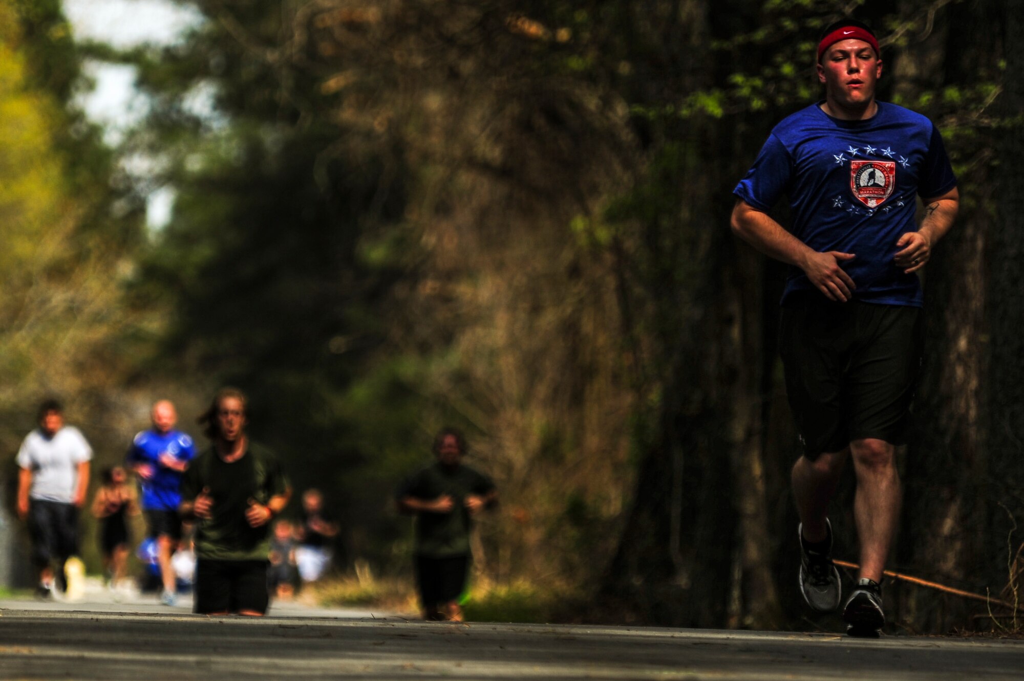 Members of Team Seymour near the finish line during a 5K Fun Run, April 3, 2015, at Seymour Johnson Air Force Base, North Carolina. The run was held in support of a Team Seymour Airman who suffered debilitating injuries during an accident. (U.S Air Force photo/Senior Airman Brittain Crolley)