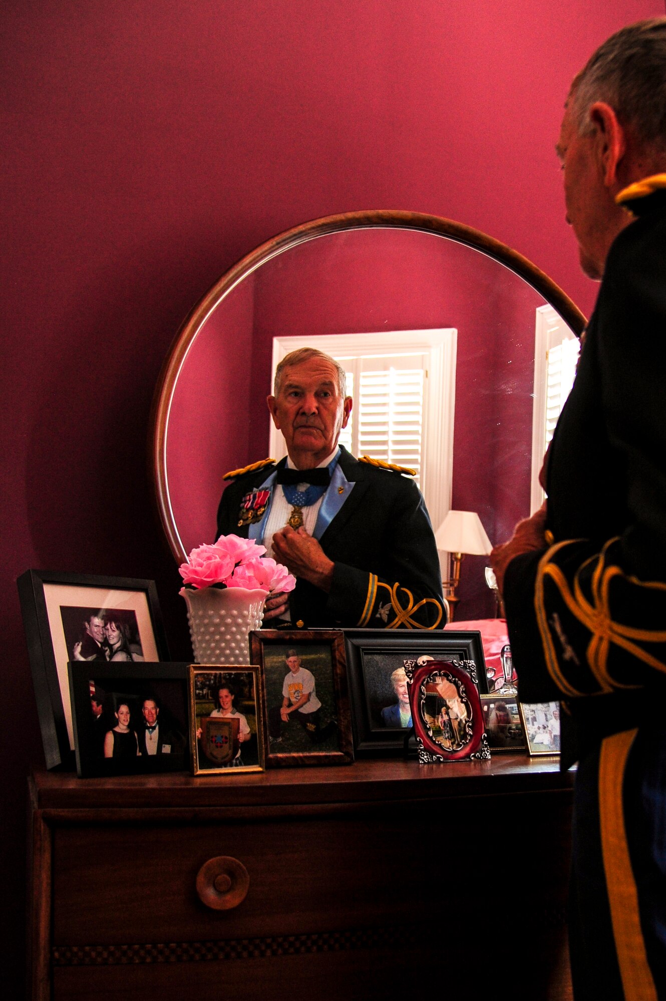 Retired U.S. Army Col. Walter “Joe” Marm makes adjustments to his Medal of Honor while getting dressed in his Class A uniform, June 30, 2015, at his home in Fremont, North Carolina. Marm is one of only 3,495 Medal of Honor recipients in U.S. military history and one of only 79 still alive today. (U.S. Air Force photo/Senior Airman Brittain Crolley)