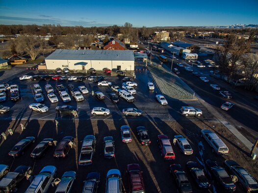Law enforcement vehicles line up to convoy through Mountain Home, Idaho, Dec. 5, 2015. Military and civilian law enforcement officers each took children to the nearby shopping center to purchase presents for their families during the annual Shop with a Cop event.(Courtesy photo by Samuel Morse)
