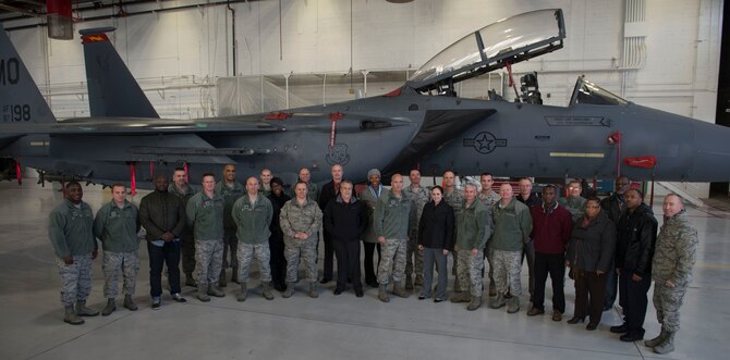 Maj. Gen. Glenn Davis, Air Force Life Cycle Management Center mobilization assistant to the commander, and members of the 366th Maintenance Group pose for a group photo at Mountain Home Air Force Base, Idaho, Dec. 3, 2015. During his time on the base, Davis received an operations brief, toured the Aircraft Maintenance Squadron and visited airmen in their workcenters. (U.S. Air Force photo by Senior Airman Malissa Lott/RELEASED)
