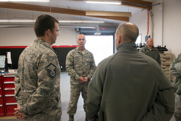 Master Sgt. Michael Hanley, 366th Aircraft Maintenance Squadron support section chief, and Capt. Wesley Sheppard, 366th Aircraft Maintenance Unit officer in charge, brief Maj. Gen. Glenn Davis, Air Force Life Cycle Management Center mobilization assistant to the commander, on the day-to-day jobs of the 389th AMU at Mountain Home Air Force Base, Idaho, Dec. 3, 2015. Davis came to see first-hand the capabilities of Mountain Home’s Strike Eagles. (U.S. Air Force photo by Senior Airman Malissa Lott/RELEASED)