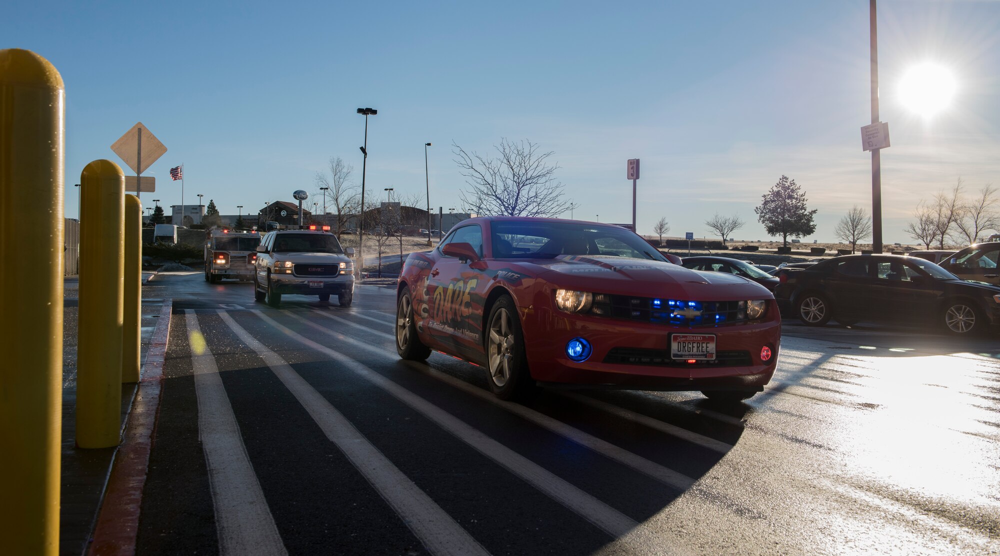 Law enforcement agencies arrive at a local shopping center for the final festivity of the day for the Shop with a Cop event, Dec. 5, 2015 in Mountain Home, Idaho. They convoyed through town and allowed children participating in the event to ride along. (U.S. Air Force photo by Airman 1st Class Connor J. Marth/Released)