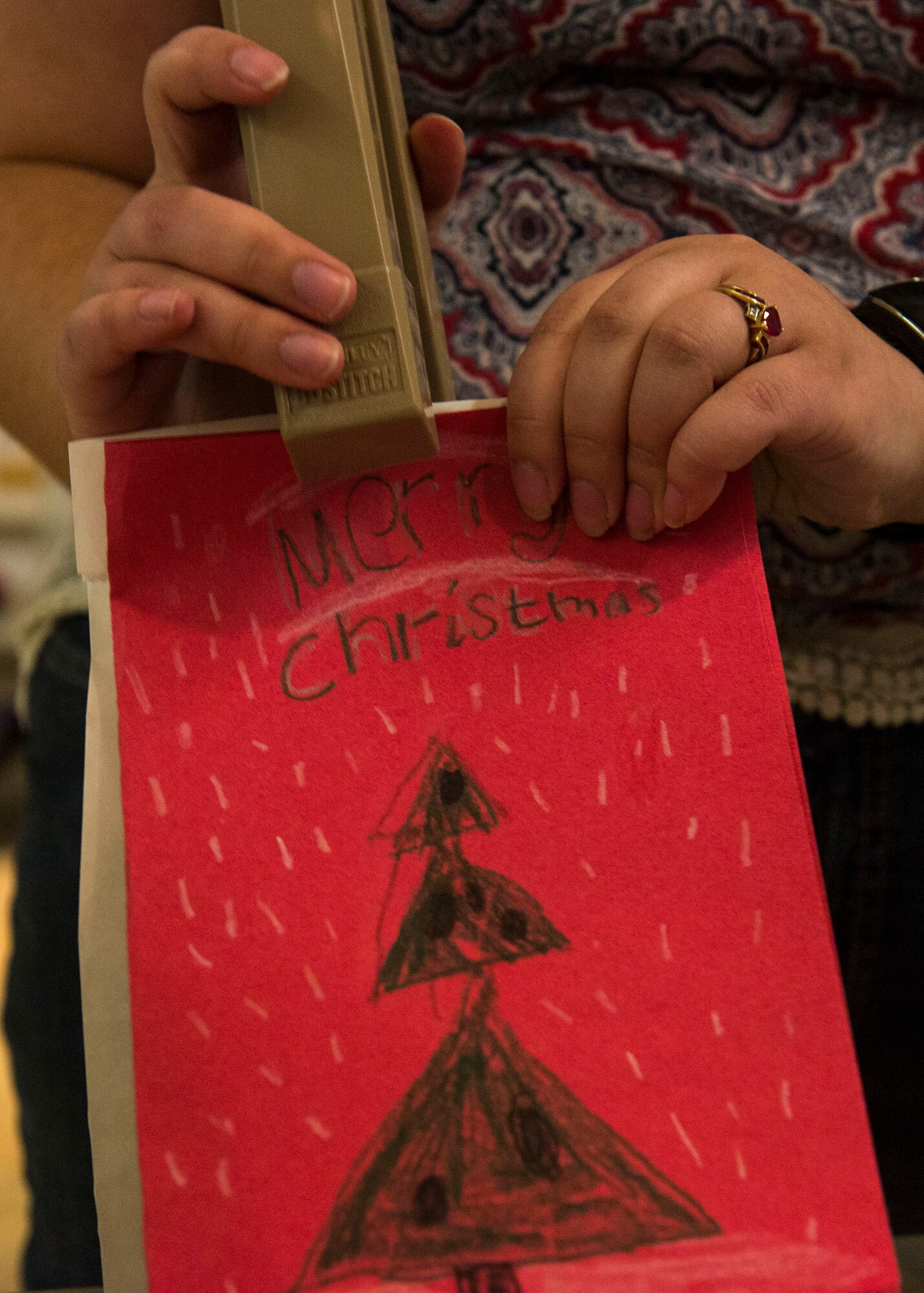 A Christmas card is stapled to a bag of cookies that will be distributed to Airmen as a part of the 2015 cookie drive at Holloman Air Force Base, N.M., Dec. 7. Members of Team Holloman and the local community baked more than 12,000 cookies for Airmen living in the dorms to bring a little taste of home to those who might not be able to see their family over the holidays. (U.S. Air Force photo by Senior Airman Chase Cannon)