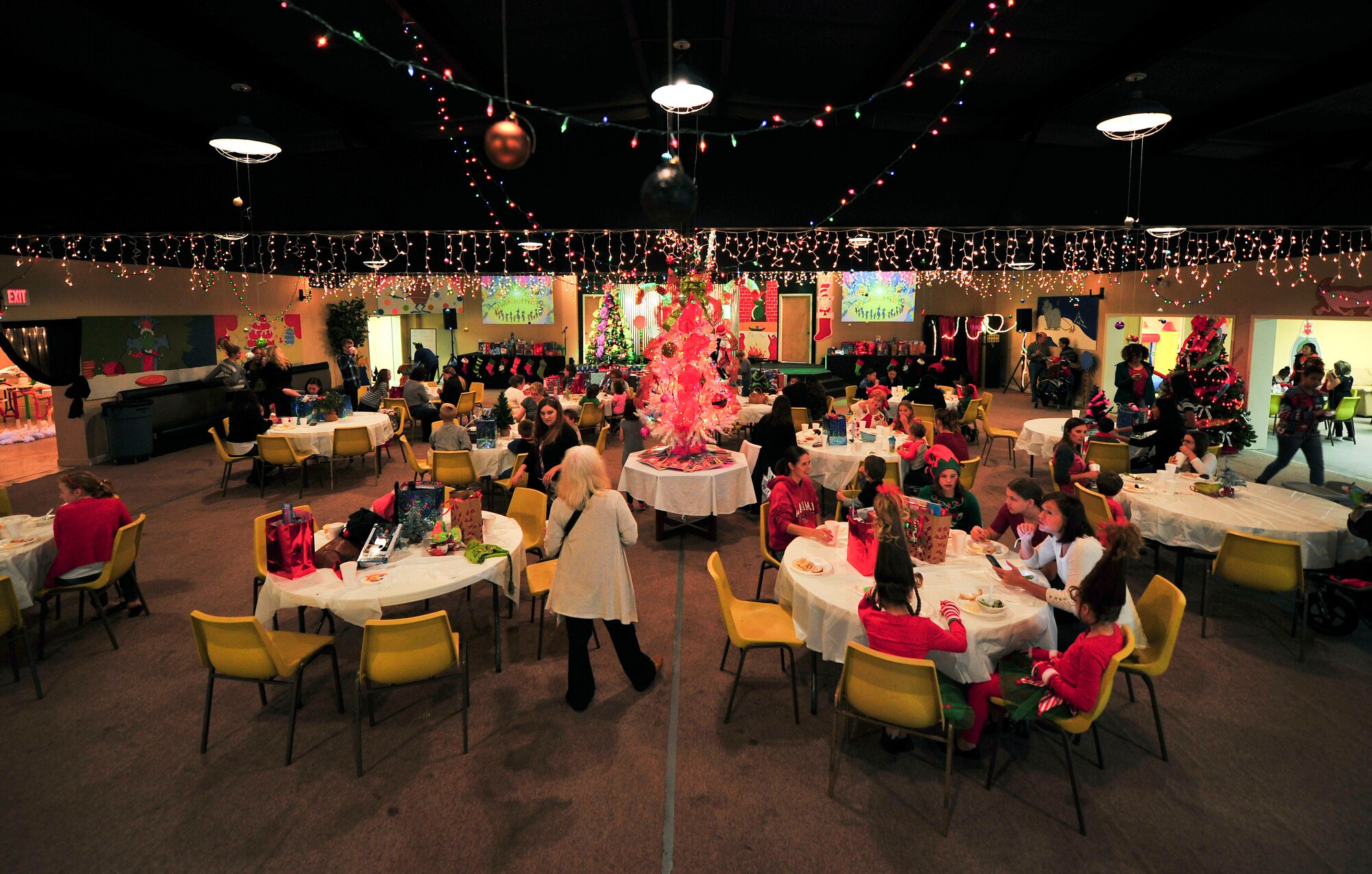 Children and families enjoy the free Hearts Apart ‘Who-liday’ event Dec. 5 at the Northside Baptist Church. This year’s theme was “How the Grinch Stole Christmas,” and children came prepared for the event dressing up in costumes and in the holiday spirit. (U.S. Air Force photo by Senior Airman Dustin Mullen/Released)