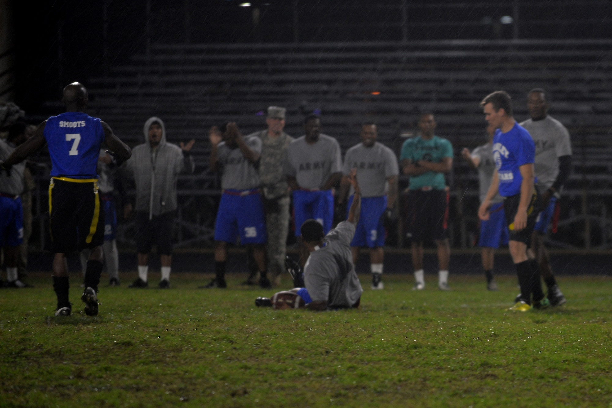 The Fort Eustis All-Stars celebrate gaining yardage during the Joint Base Langley-Eustis flag football championship game at Fort Eustis, Va., Dec. 2, 2015. The Eustis All-Stars won the championship with a final score of 7-6. ( U.S. Air Force photo by Staff Sgt. Natasha Stannard)