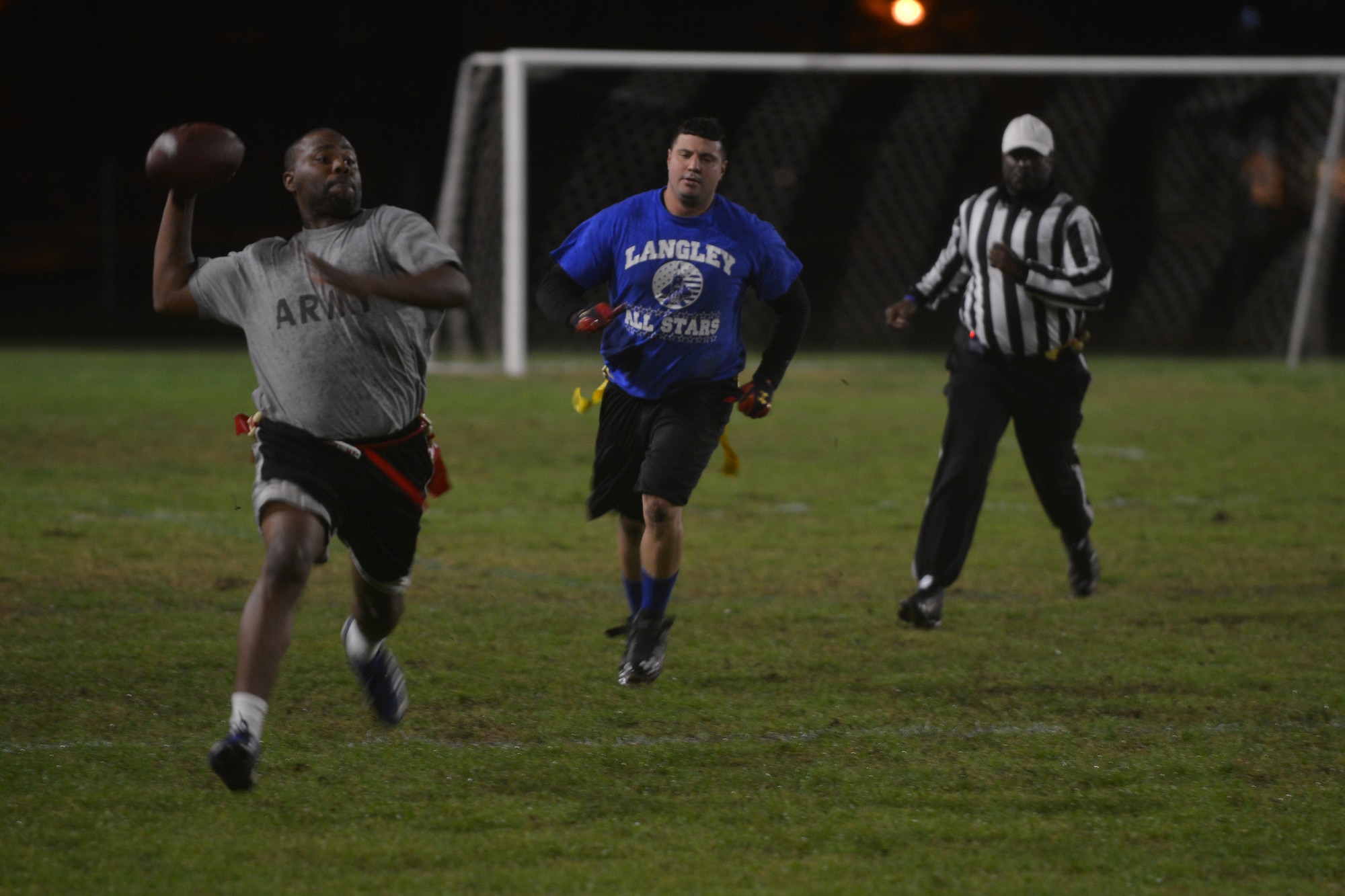 William Smith, a captain and quarterback for the Fort Eustis All-Star flag football team, throws the ball to a receiver during the Joint Base Langley-Eustis (JBLE) flag football championship game at Fort Eustis, Va., Dec. 2, 2015. The installations’ all-star teams were comprised of top players from various units’ teams across JBLE. ( U.S. Air Force photo by Staff Sgt. Natasha Stannard)
