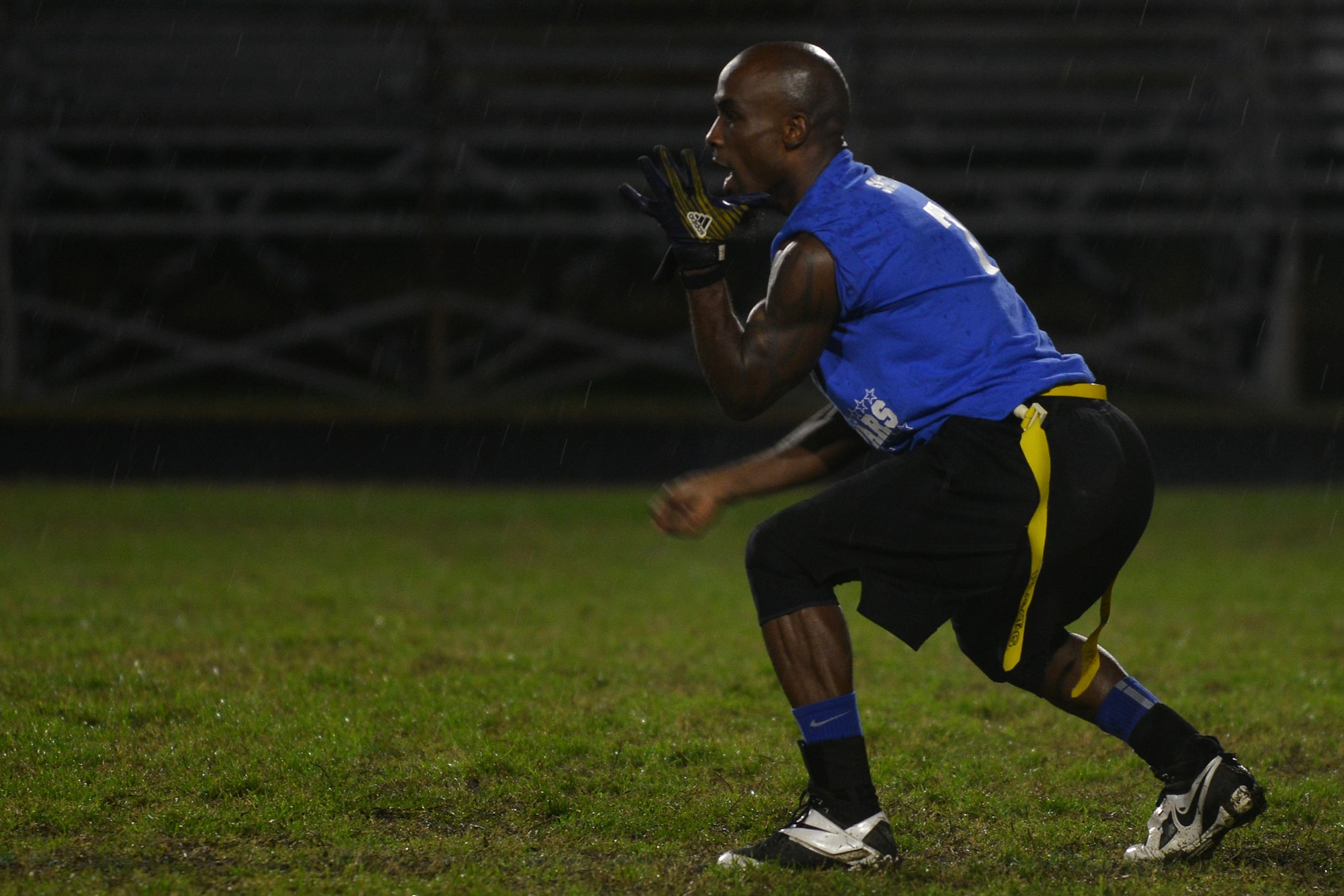 Gregory Smoots, a captain and quarterback for the Langley All-Star flag football team, signals to have the ball hiked during the Joint Base Langley-Eustis (JBLE) championship flag football game at Fort Eustis, Va., Dec. 2, 2015. This was the first flag football championship game between the two installations that make up JBLE. ( U.S. Air Force photo by Staff Sgt. Natasha Stannard)
