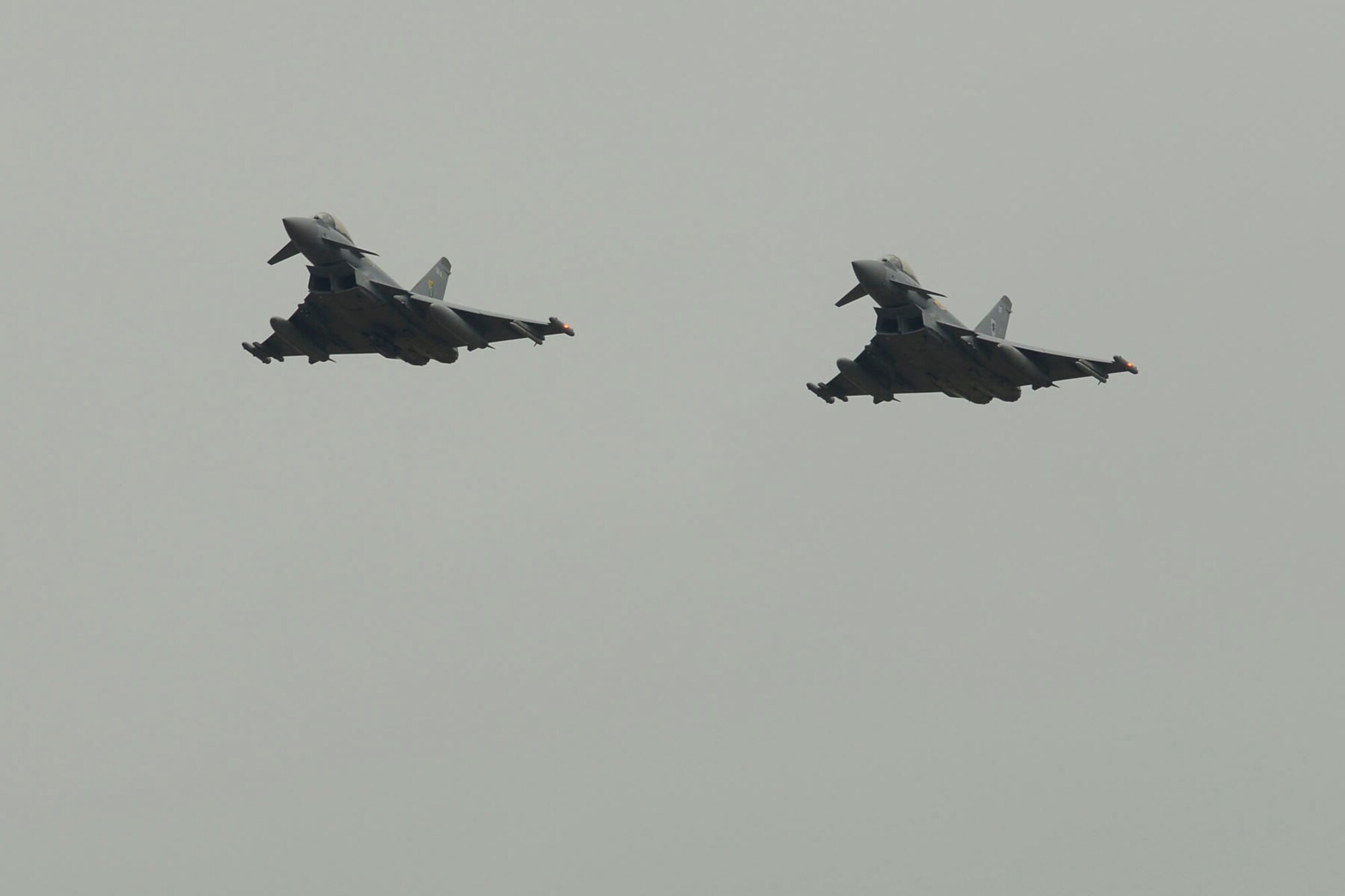 Two British Royal Air Force (RAF) Typhoons prepare to land at Langley Air Force Base, Va., Dec. 3, 2015. The RAF along with the French air force, are partnering with the U.S. Air Force for the inaugural Trilateral Exercise at Joint Base Langley-Eustis. (U.S. Air Force photo by Airman 1st Class Derek Seifert)