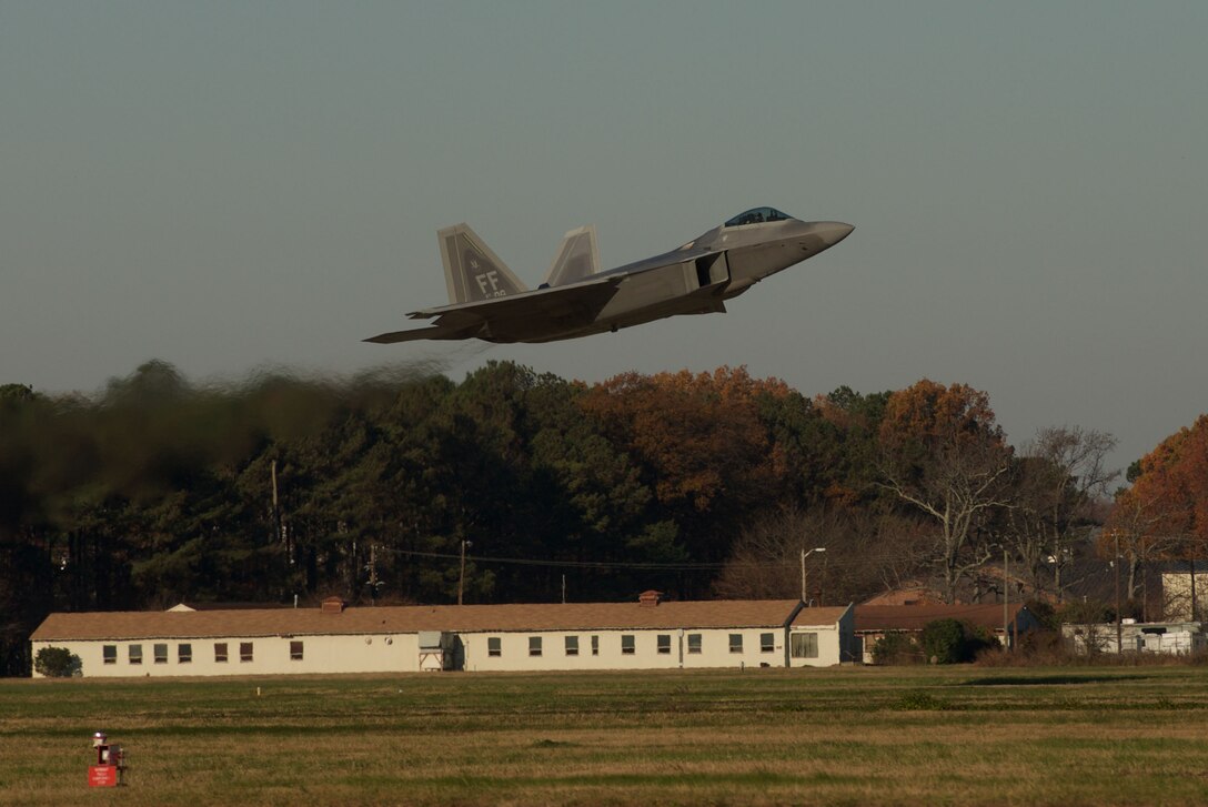 A U.S. Air Force F-22 Raptor takes off during the inaugural Trilateral Exercise at Langley Air Force Base, Va., Dec. 4, 2015. Approximately 225 U.S. Airmen worked alongside British Royal Air Force and French air force personnel during the exercise. (U.S. Air Force photo by Airman 1st Class Derek Seifert)