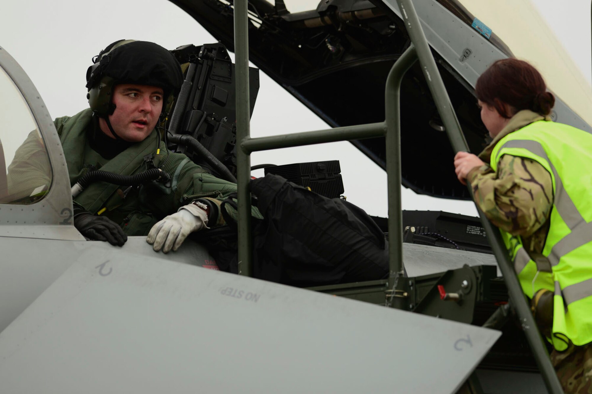 A British Royal Air Force (RAF) pilot receives guidance after landing at Langley Air Force Base, Va., Dec. 3, 2015. Approximately 600 Service members from the U.S. Air Force, RAF and French air force are involved in the inaugural Trilateral Exercise. (U.S. Air Force photo by Airman 1st Class Derek Seifert)