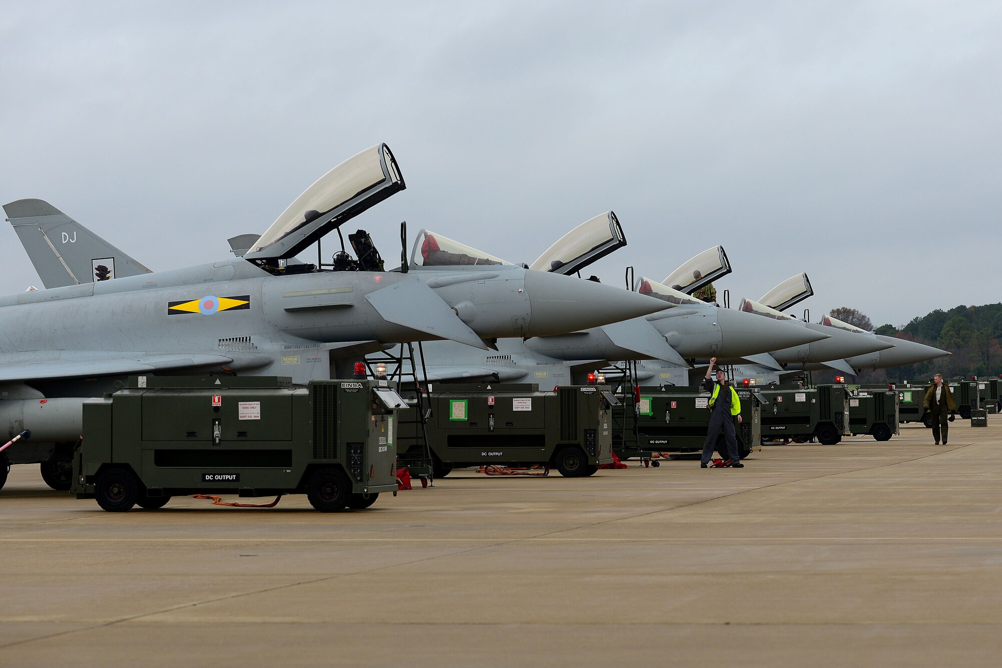 The British Royal Air Force (RAF) Eurofighter Typhoons line up for post-flight checks at Langley Air Force Base, Va., Dec. 3, 2015.The aircraft will be part of a Trilateral Exercise that will simulate a highly-contested, degraded and operationally-limited environment where U.S., partner pilots and ground crews can test their readiness and enhance interoperability through combined operations. (U.S. Air Force photo by Senior Airman Kimberly Nagle)