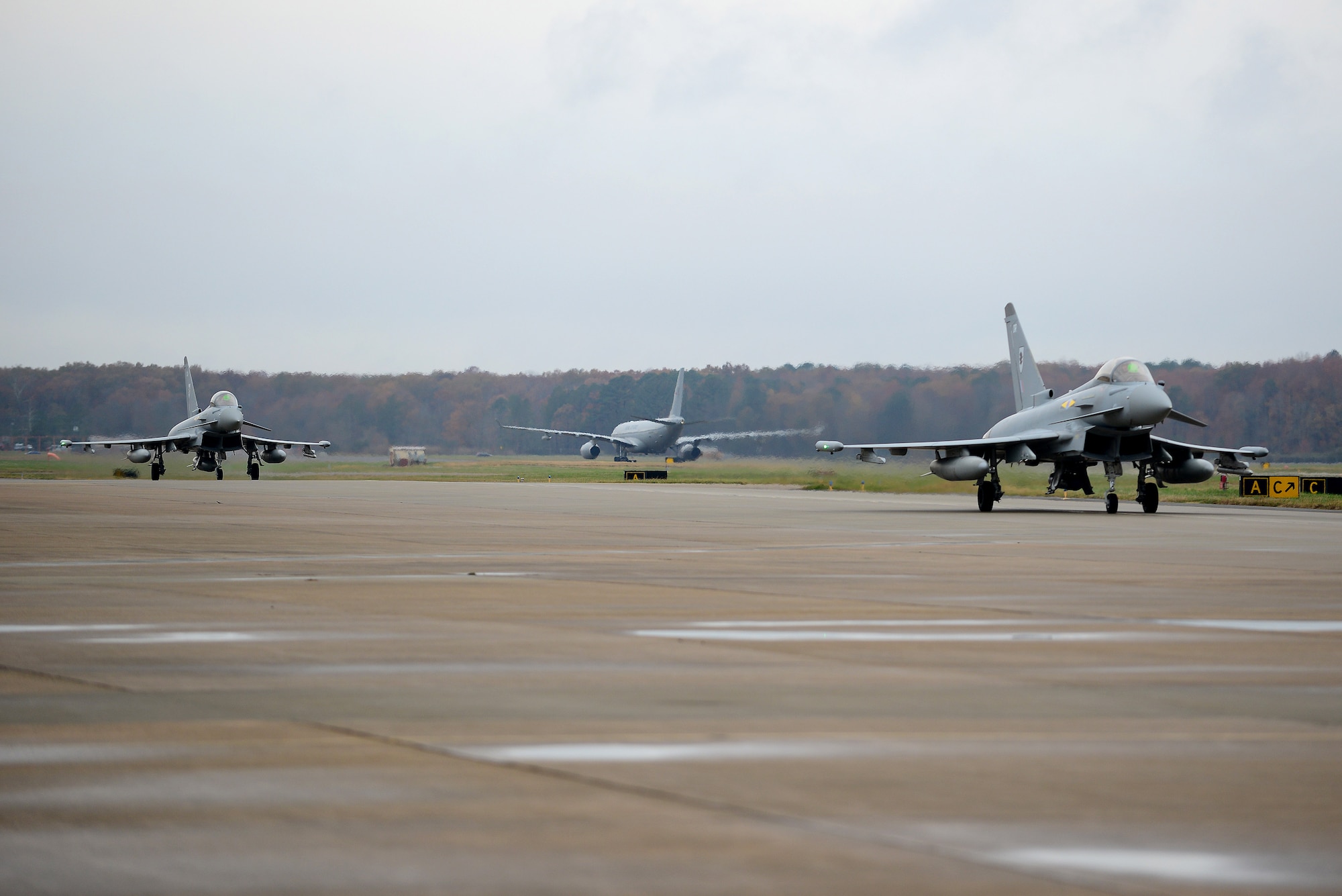 British Royal Air Force (RAF) aircraft prepare to park at Langley Air Force Base, Va., Dec. 3, 2015. Several RAF aircraft arrived in provision for the inaugural Trilateral Exercise along with the French air force and the U.S. Air Force aircraft. (U.S. Air Force photo by Senior Airman Kimberly Nagle) 