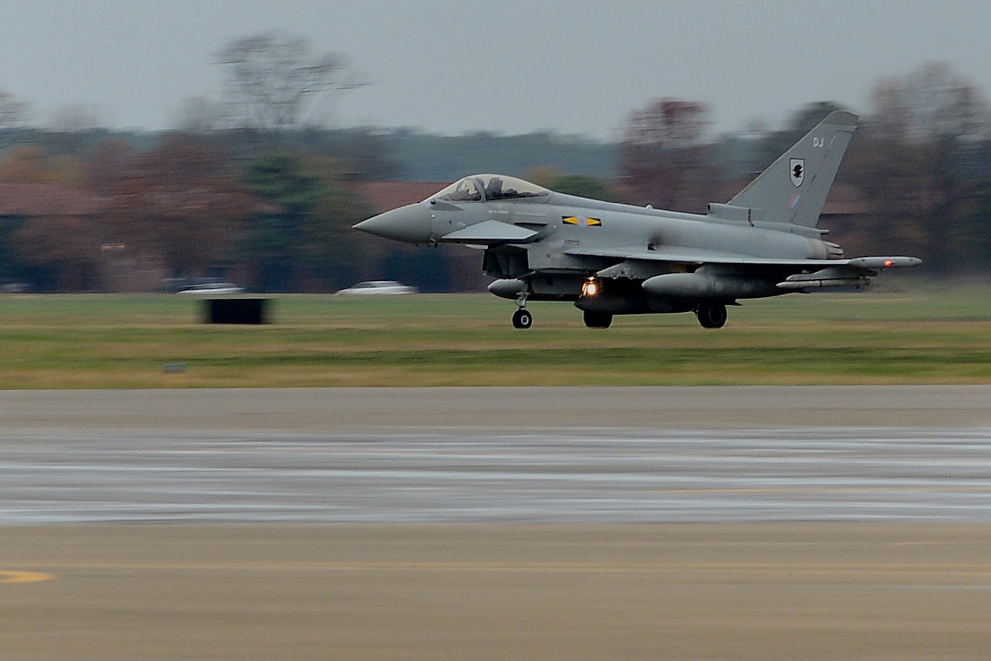 A British Royal Air Force (RAF) Eurofighter Typhoon lands at Langley Air Force Base, Va., Dec. 3, 2015. The Typhoon joins the U.S. Air Force F-22 Raptor, the French air force Rafale, along with other aircraft for an inaugural Trilateral Exercise. (U.S. Air Force photo by Senior Airman Kimberly Nagle)