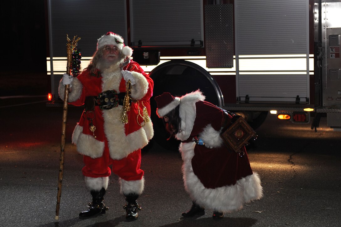 Santa and Mrs. Claus arrive at the 48th annual Holiday Tree Lighting ceremony at Langley Air Force Base, Va., Dec. 8, 2015. Children assisted the Tidewater Arts Outreach carolers in singing, “Here Comes Santa Claus,” when Santa made his surprise appearance. (U.S. Air Force photo by Senior  Airman Brittany E.N. Murphy)