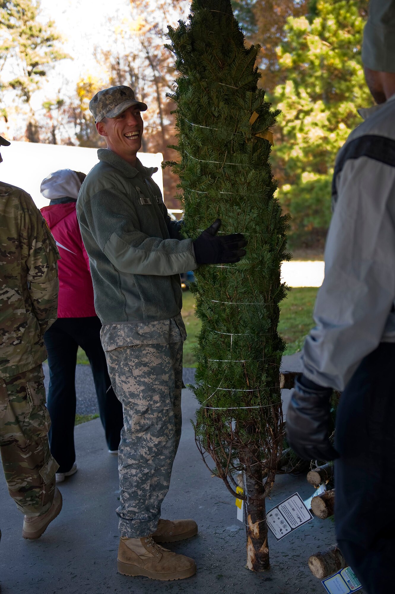 U.S. Army Sgt. Jacob Atkins, a leading seaman assigned to the 331st Transportation Company, picks out his Christmas tree at the Trees for Troops event at Fort Eustis, Va., Dec. 4, 2015. The event, which supplied free trees to military members and their families, was open to all active-duty Service members and their dependents. (U.S. Air Force photo by Senior Airman Breonna Veal)
