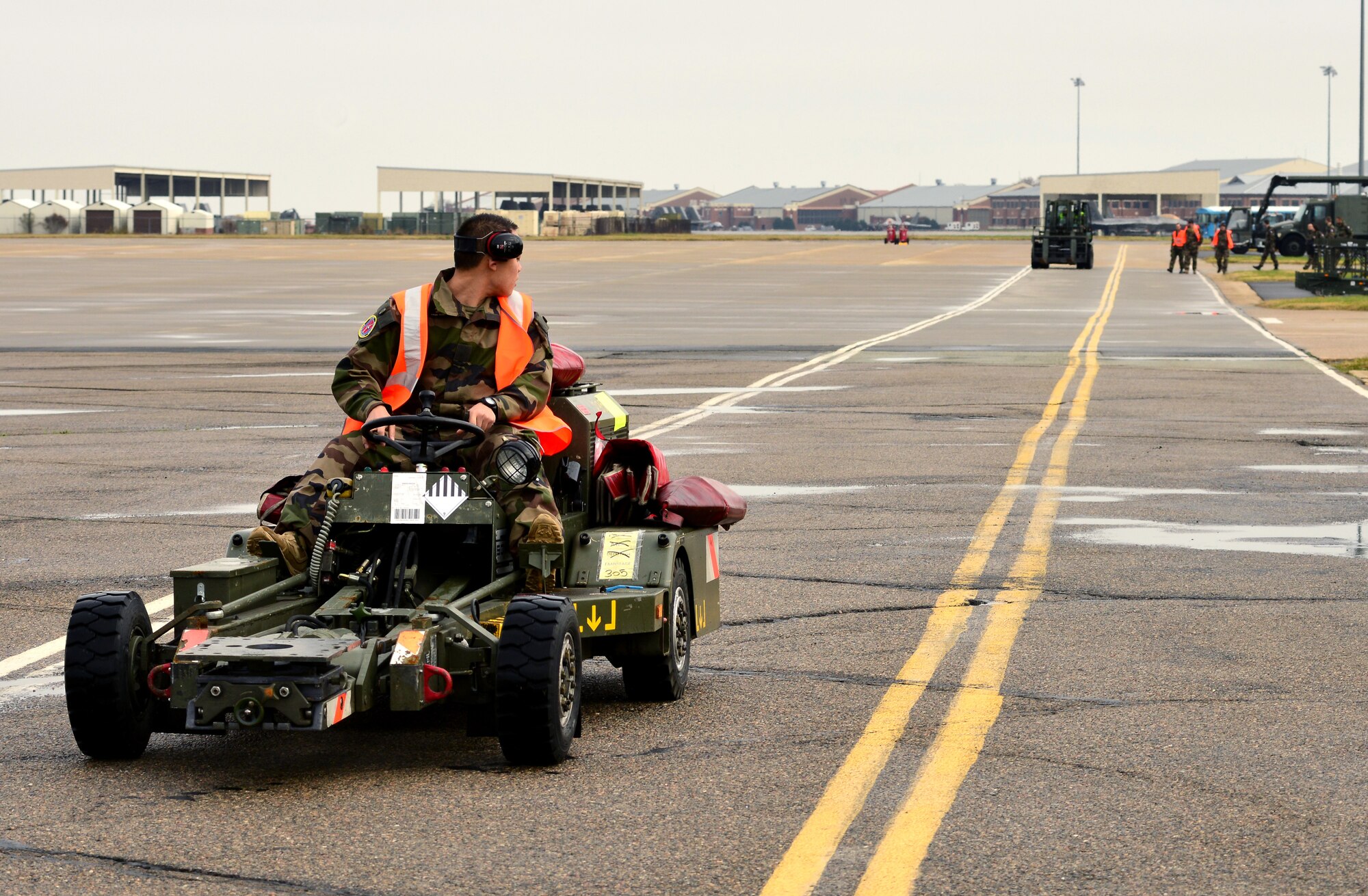 A member of the French air force drives a munitions jammer before the inaugural Trilateral Exercise, at Langley Air Force Base, Va., Dec. 1, 2015. Approximately 600 personnel will participate in the exercise to share and develop techniques and tactics to better the forces’ ability to fly, fight and win in modern highly-contested, anti-access/area denial environments. (U.S. Air Force photo by Senior Airman Aubrey White)