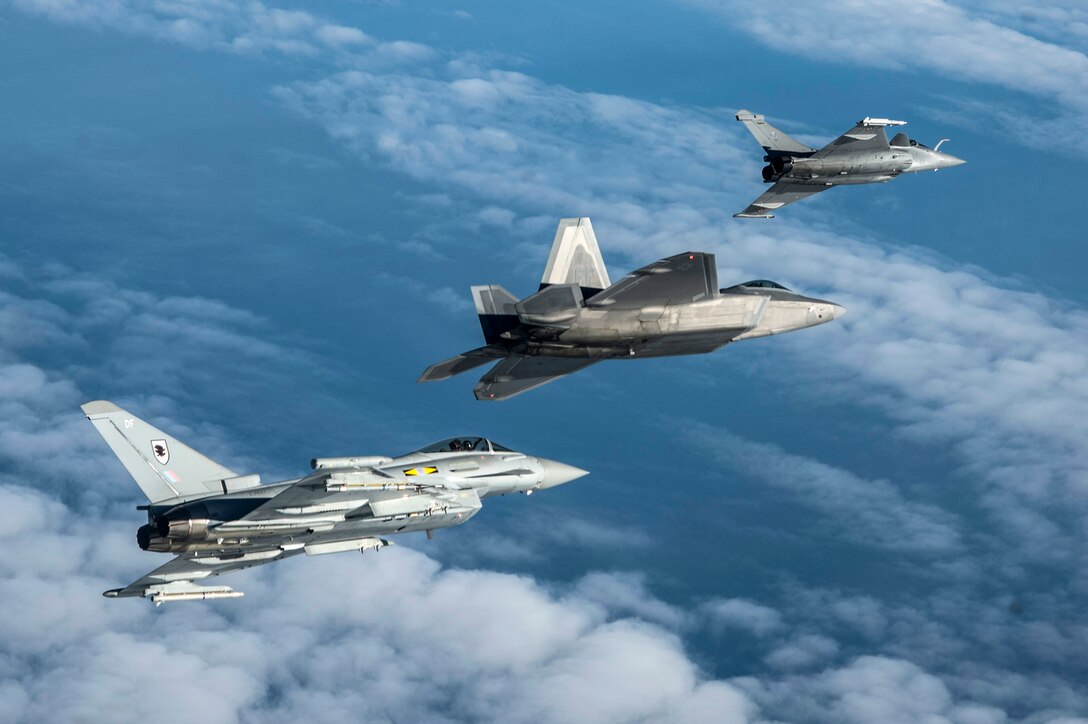 A British Royal Air Force Typhoon, U.S. Air Force F-22 Raptor and French air force Rafale fly in formation as part of a Trilateral Exercise held at Langley Air Force Base, Va., Dec. 7, 2015. The 5th generation aircraft involved in the exercise are the most technologically advanced assets in the world today. (U.S. Air Force photo by Senior Airman Kayla Newman)
