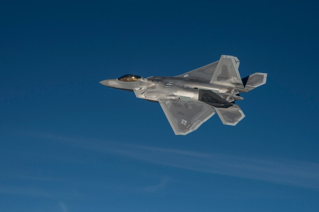A U.S. Air Force F-22 Raptor participates in the inaugural Trilateral Exercise held at Langley Air Force Base, Va., Dec. 7, 2015. The Raptor is capable of receiving information from a multitude of airborne and ground based platforms, then directing other assets to aid in mission success or away from potential threats. (U.S. Air Force photo by Senior Airman Kayla Newman)