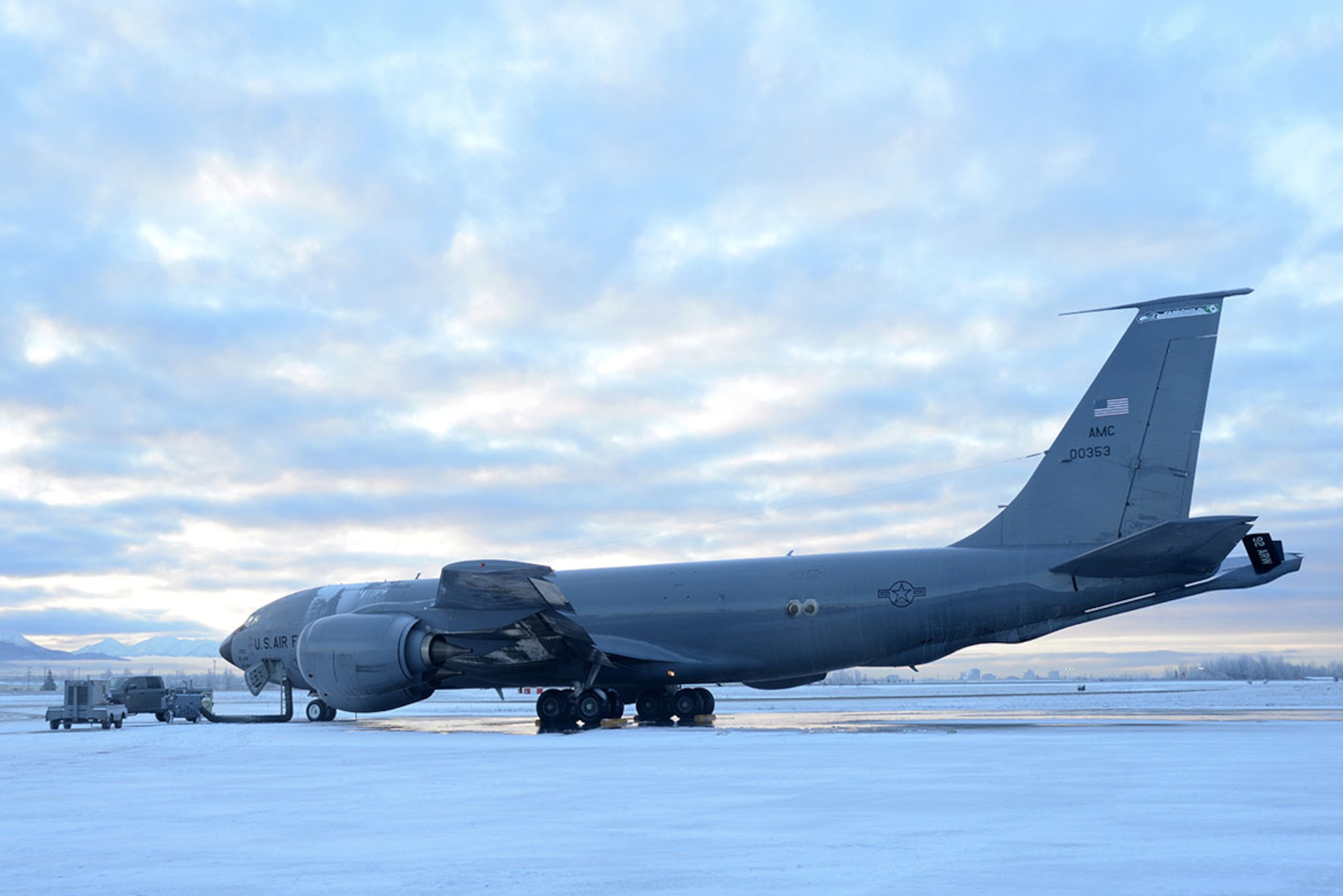 A KC-135 Stratotanker from Fairchild Air Force Base prepares to leave the flight line at Joint Base Elmendorf-Richardson, Alaska, Dec. 3, 2015. When a flight is delayed, or aircraft need to taxi over an extended period of time, they might refreeze, so  anti-ice is added to the solution to prevent that from happening. (U.S. Air Force photo by Airman 1st Class Christopher R. Morales)