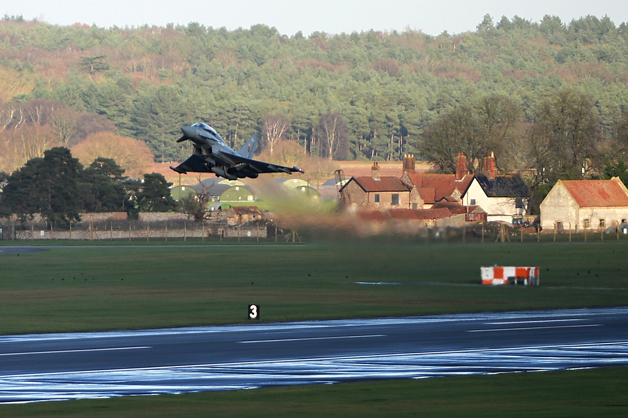 A Eurofighter Typhoon assigned to Royal Air Force Coningsby takes off from Royal Air Force Lakenheath, England, Dec. 8, 2015. Members of the 494th FS worked with the RAF pilots to strengthen U.S. Air Force interoperability with the U.K. counterparts through combat training. (U.S. Air Force photo by Staff Sgt. Emerson Nuñez/Released)