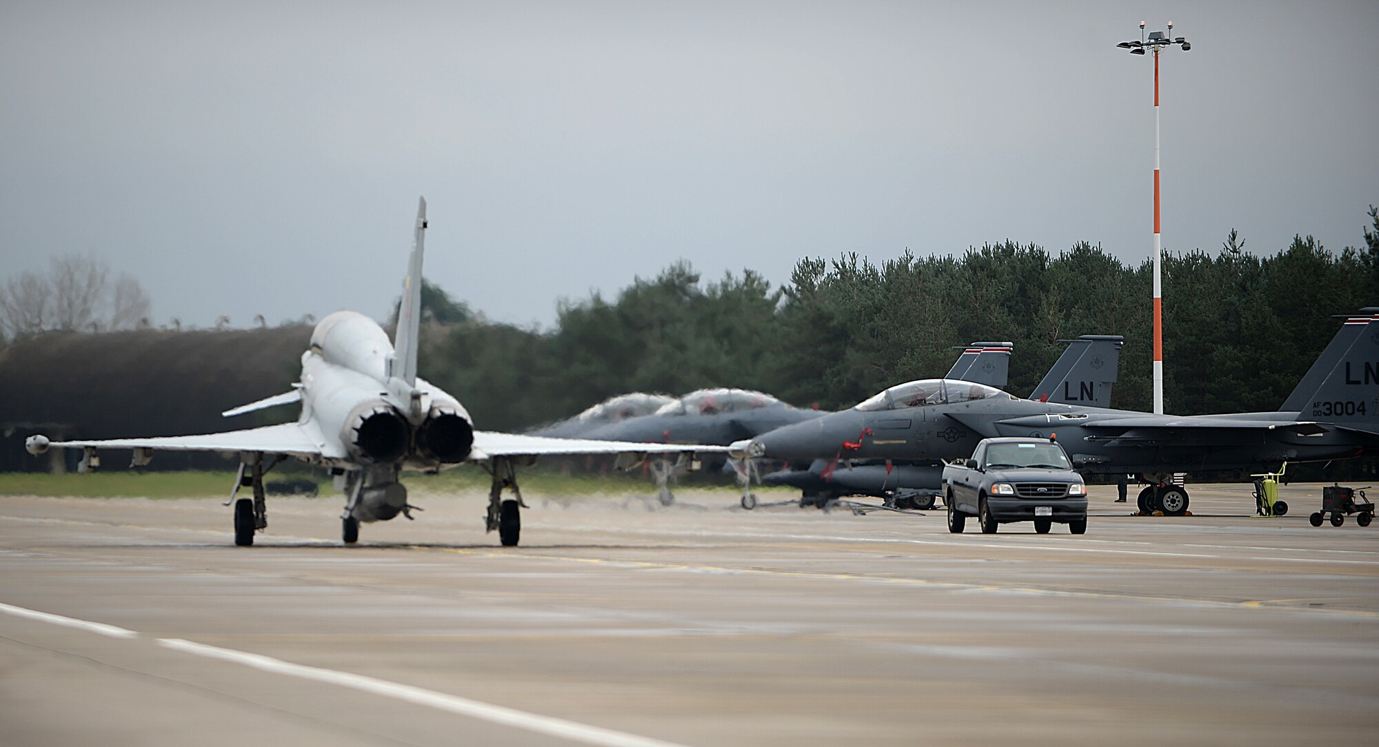 A Eurofighter Typhoon assigned to Royal Air Force Coningsby taxis to the runway during an exercise with the 494th Fighter Squadron at RAF Lakenheath, England, Dec. 7, 2015. Fighter pilots from RAF Coningsby and the 494th Fighter Squadron partnered up for dissimilar air combat training where they had mock air-to-air combat fights where in this case, both aircrafts went up against each other to test each other’s and their own capabilities. (U.S. Air Force photo by Staff Sgt. Emerson Nuñez/Released) 