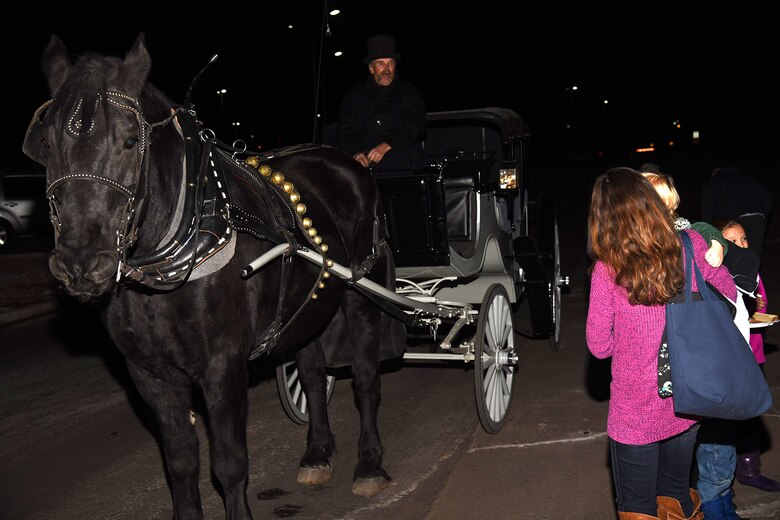 PETERSON AIR FORCE BASE, Colo. – Carriage rides await families of deployed Airmen as part of the fun at the Holiday Tree Lighting ceremony Dec. 4, 2015. There was also food, fun and other entertainment provided by the Peterson Chapel. (U.S. Air Force photo by Robb Lingley)