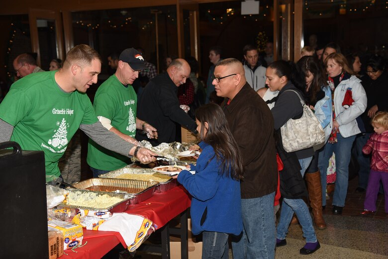 PETERSON AIR FORCE BASE, Colo. – The Peterson Chapel provides food and fun during the Holiday Tree Lighting ceremony and Deployed Families Dinner on Dec. 4, 2015. This year’s ceremony featured Santa Claus, the Grinch and other family activities. (U.S. Air Force photo by Robb Lingley)