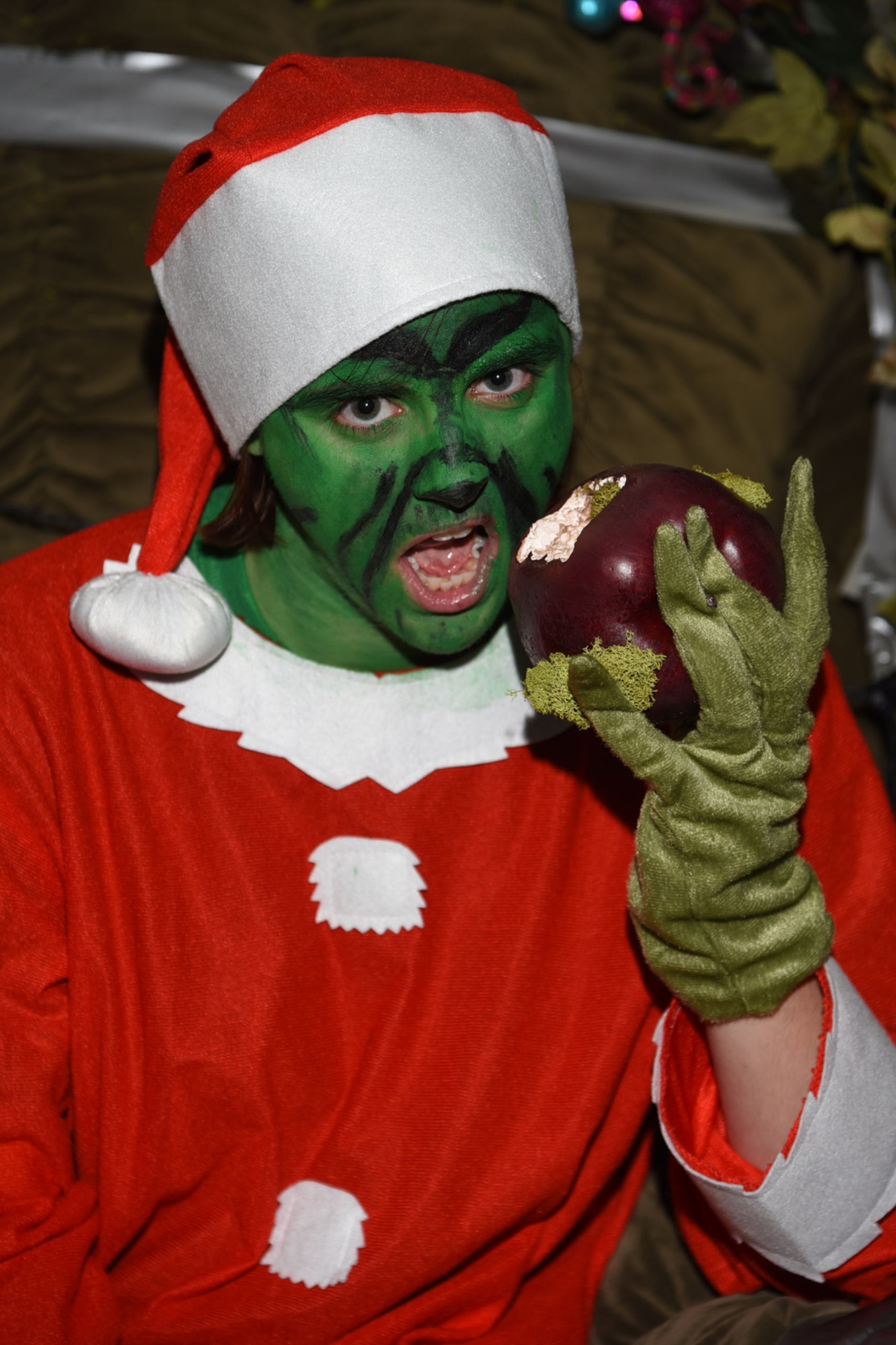 PETERSON AIR FORCE BASE, Colo. – The Grinch visits the Holiday Tree Lighting ceremony Dec. 4, 2015. Santa also visited while a children’s choir performed and the Peterson Chapel provided food and fun to kick off the holiday season. (U.S. Air Force photo by Robb Lingley)