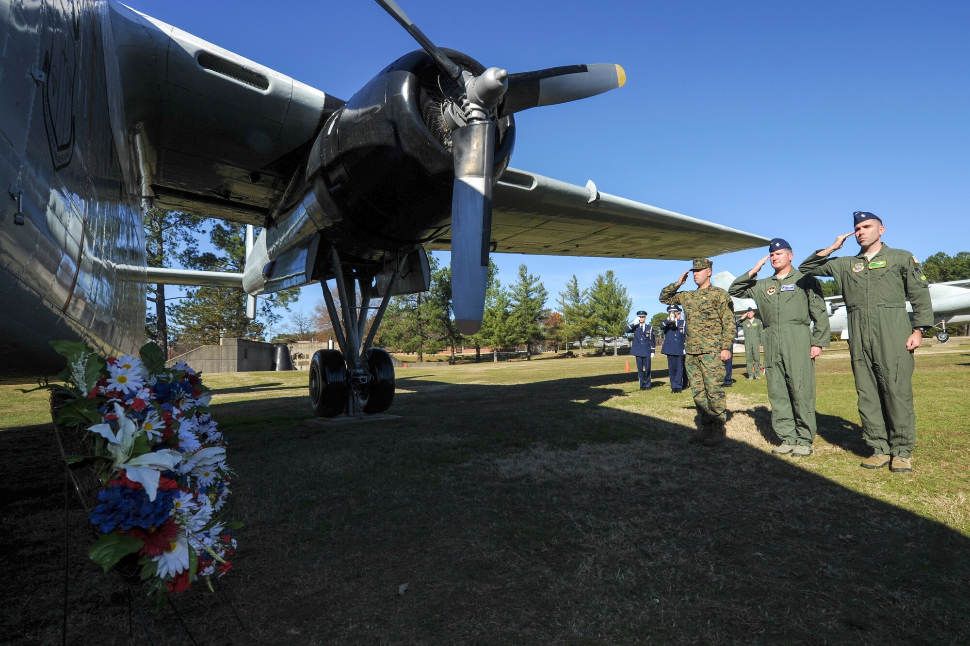 Commanders from across Little Rock Air Force Base salute wreaths placed
beside a C-119 Flying Boxcar static display Dec. 7, 2015, at Heritage Park
at Little Rock AFB, Ark. The service members honored past Airmen and Marines
during a Chosin Reservoir remembrance ceremony. (U.S. Air Force photo/Senior
Airman Harry Brexel)
