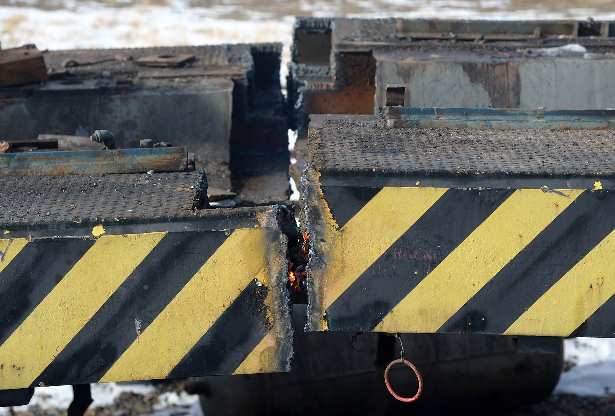 With all the major parts removed, U.S. Air Force S12 Switcher 1864’s frame glows after being cut into two halves at Hill Air Force Base, Utah Dec 02, 2015. The smaller sections will be removed from the base on flatbed trailers.  (U.S. Air Force photo/Alex R. Lloyd)