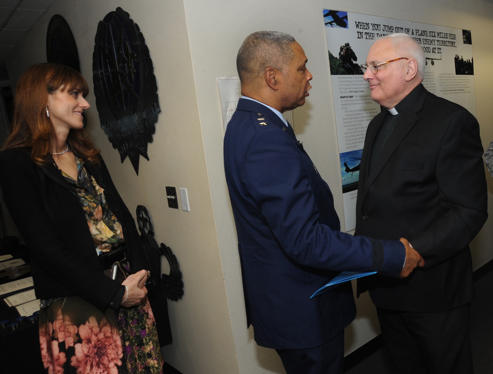 U.S. Air Force Maj. Gen. Garry Dean, The Special Assistant to the Chief, National Guard Bureau, along with his wife Elena, greet retired Oregon Air National Guard Chaplain Richard Sirianni, who delivered the Invocation during General Dean’s formal retirement ceremony, Dec. 6, 2015, Portland Air National Guard Base, Ore. (U.S. Air National Guard photo by Tech. Sgt. John Hughel, 142nd Fighter Wing Public Affairs)