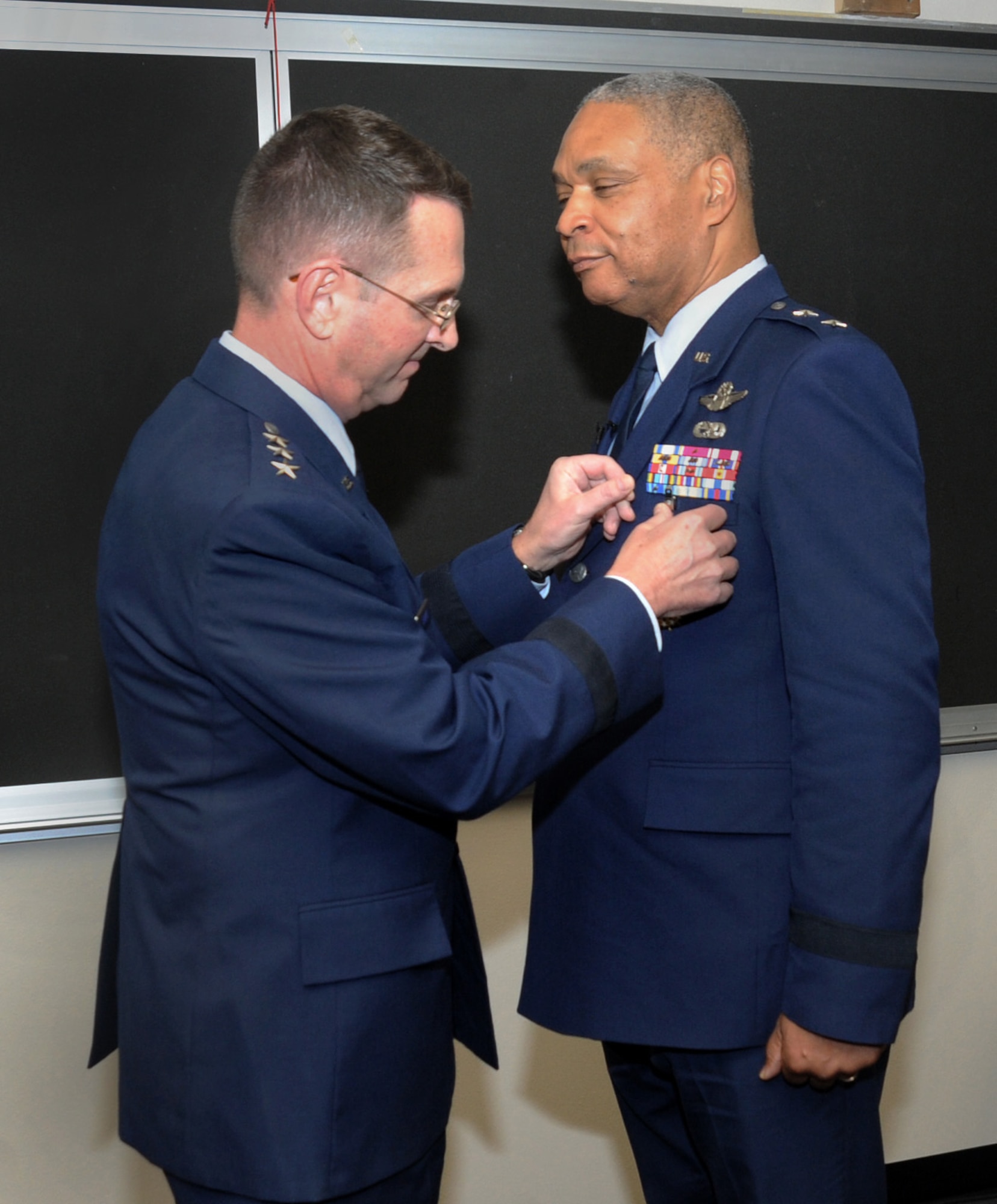 U.S. Air Force Lt. Gen. Joseph L. Lengyel, Vice Chief, National Guard Bureau, left, presents The Distinguished Service Medal to Maj. Gen. Garry Dean, The Special Assistant to the Chief, National Guard Bureau, right, during his formal retirement ceremony held at the Portland Air National Guard Base, Ore., Dec. 6, 2015. (U.S. Air National Guard photo by Tech. Sgt. John Hughel, 142nd Fighter Wing Public Affairs) 