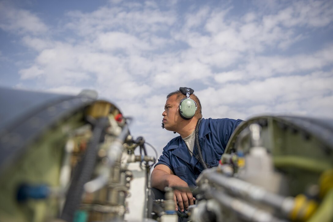U.S. Air Force Tech. Sgt. Carlo Patalinghug examines an F-16 Fighting Falcon aircraft to isolate and repair a hydraulic leak on Bagram Airfield, Afghanistan, Nov. 30, 2015. Patalinghug is a crew chief assigned to the 455th Expeditionary Aircraft Maintenance Squadron. U.S. Air Force photo by Tech. Sgt. Robert Cloys