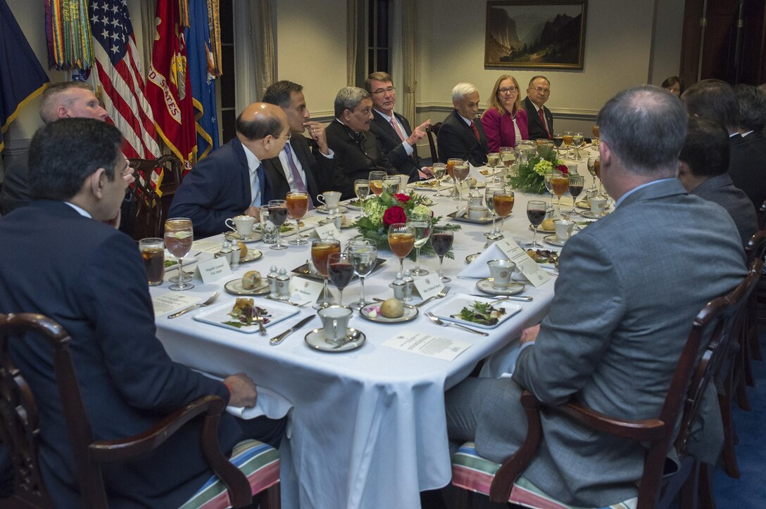 U.S. Defense Secretary Ash Carter, left center, speaks with Indian Defense Minister Manohar Parrikar during a dinner at the Pentagon, Dec. 9, 2015. DoD photo by Air Force Senior Master Sgt. Adrian Cadiz