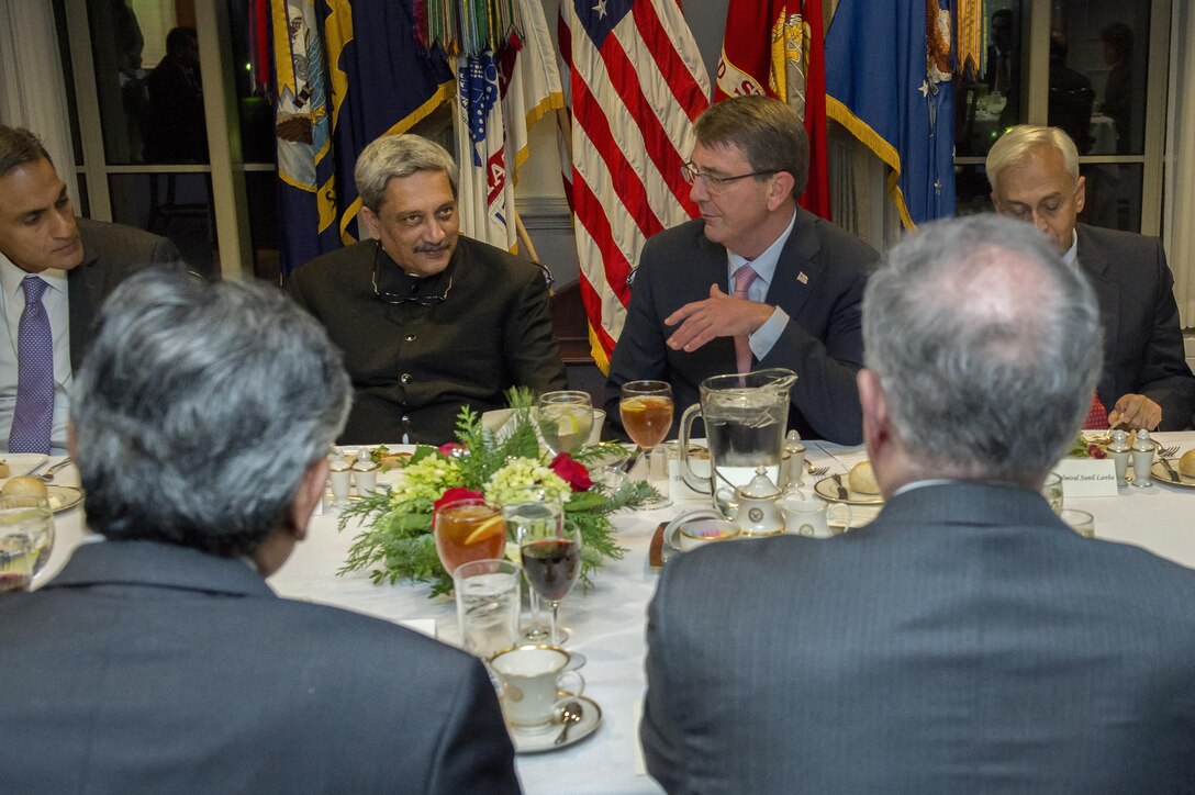 U.S. Defense Secretary Ash Carter, center right, speaks with Indian Defense Minister Manohar Parrikar during a dinner at the Pentagon, Dec. 9, 2015. DoD photo by Air Force Senior Master Sgt. Adrian Cadiz