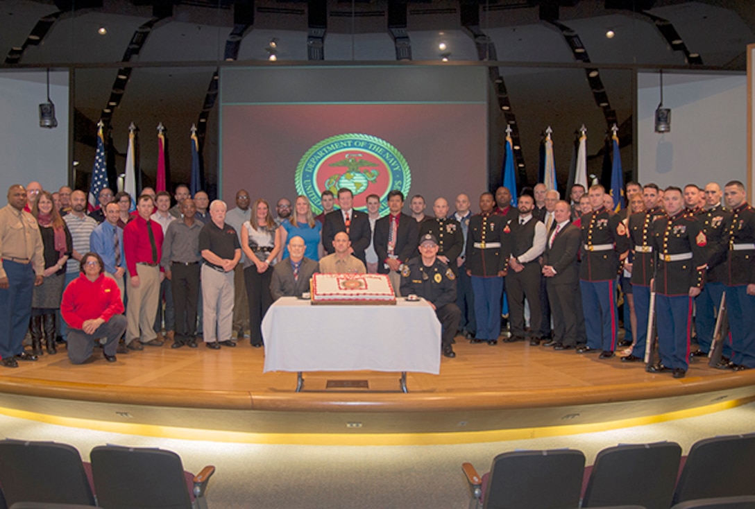 Current and former Marines from the Columbus area pose for a group photo at the Marine Corps’ 240th Birthday Celebration inside the Building 20 auditorium on Defense Supply Center Columbus Nov. 10.