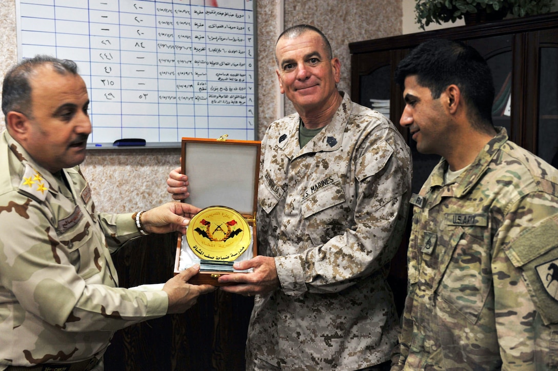 U.S. Marine Corps Sgt. Maj. Bryan Battaglia,  center, senior enlisted advisor to the chairman of the Joint Chiefs of Staff, visited service members throughout Iraq during his visit to the Middle East, Oct. 12, 2015. Battaglia visited Baghdad, Taji, Al-Taqqadum Air Base and Al-Asad Air Base as part of his battlefield circulation. DoD photo by Army Master Sgt. Terrence L. Hayes