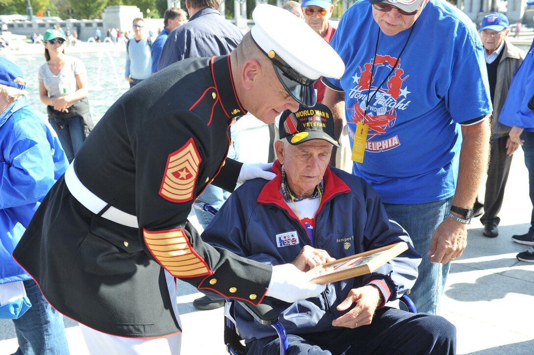 Marine Corps Sgt. Maj. Bryan Battaglia, senior enlisted advisor to the chairman of the Joint Chiefs of Staff, visited World War II, Korean War and Vietnam War veterans at the World War II Memorial as part of their honor flight visit in Washington, D.C., Oct. 5, 2015. During the stop at the World War II Memorial, Battaglia and the veterans, laid a wreath to honor the fallen men and women from Pennsylvania. DoD photo by Army Master Sgt. Terrence L. Hayes