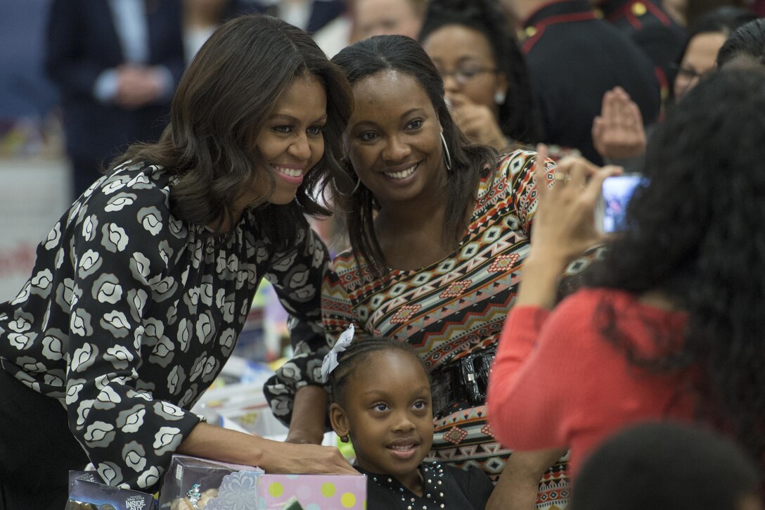 First Lady Michelle Obama poses with a military family during a Toys for Tots event on Joint Base Anacosta-Bolling in Washington, D.C., Dec. 9, 2015. DoD photo by EJ Hersom