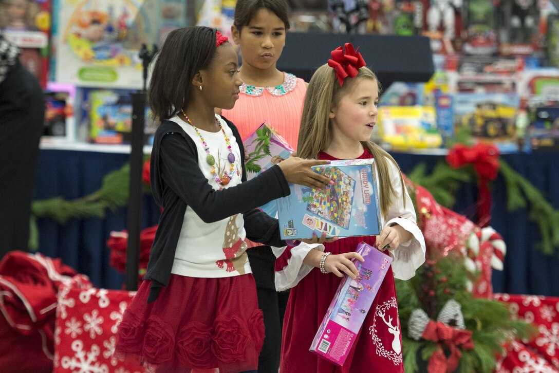 Children sort toys during a Toys for Tots event on Joint Base Anacosta-Bolling in Washington, D.C., Dec. 9, 2015. DoD photo by EJ Hersom
