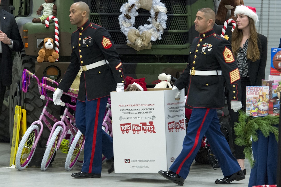 Marines carry a box of toys during a Toys for Tots event on Joint Base Anacosta-Bolling in Washington, D.C., Dec. 9, 2015. DoD photo by EJ Hersom