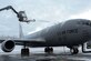 Staff Sgt. Tyler Derr, a 732nd Air Mobility Squadron avionics specialist, deices a KC-135 Stratotanker from Fairchild Air Force Base, Wash., on the flightline at Joint Base Elmendorf-Richardson, Alaska, Dec. 3, 2015. There is always a person in the truck, one in the deicer and one on the ground to make sure the aircraft is deiced all around. (U.S. Air Force photo/Airman 1st Class Christopher R. Morales)