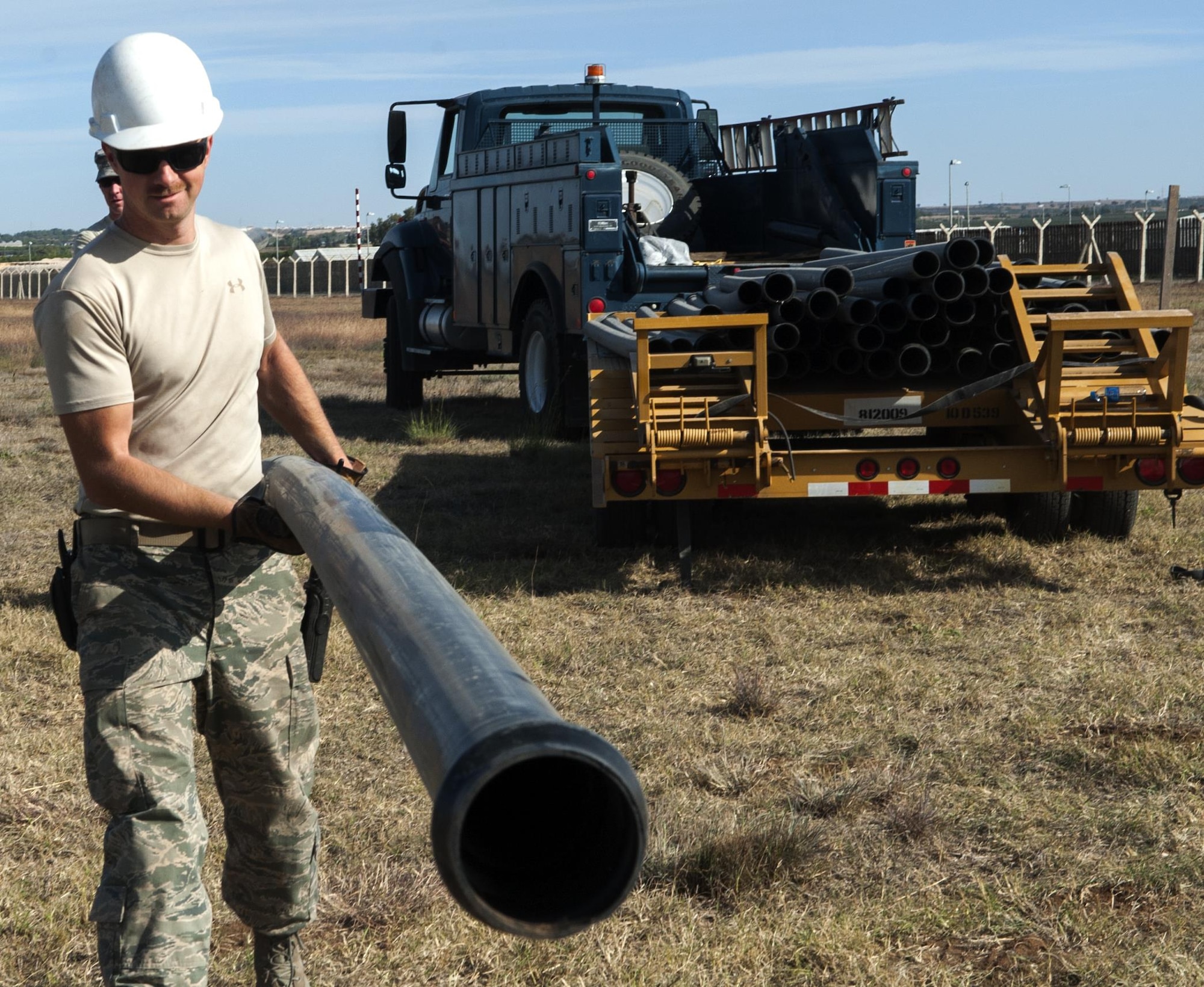 Staff Sgt. Anthony Posey, a 39th Communications Squadron cable and antenna supervisor, carries conduit to a dig site Nov. 18, 2015, at Incirlik Air Base, Turkey. The infrastructure support the 39th CS provides directly effects the air surety and Operation Inherent Resolve missions. (U.S. Air Force photo/Staff Sgt. Jack Sanders)