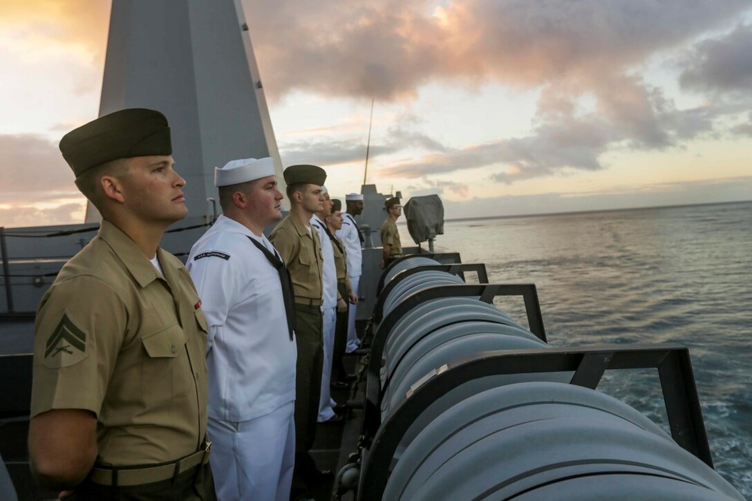 PEARL HARBOR, Hawaii (Dec. 6, 2015) U.S. Marines and Sailors man the rails as the USS Anchorage (LPD 23) pulls into port in Hawaii. Hawaii is the 15th Marine Expeditionary Unit’s last port call before heading home after their WESTPAC 15 deployment. (U.S. Marine Corps photo by Sgt. Jamean Berry/Released)