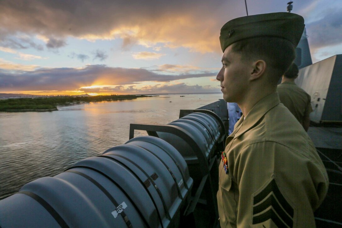 PEARL HARBOR, Hawaii  (Dec. 6, 2015) U.S. Marine Sgt. Christopher Yaun mans the rails as the USS Anchorage (LPD 23) pulls into port in Hawaii. Hawaii is the 15th Marine Expeditionary Unit’s last port call before heading home after their WESTPAC 15 deployment. (U.S. Marine Corps photo by Sgt. Jamean Berry/Released)