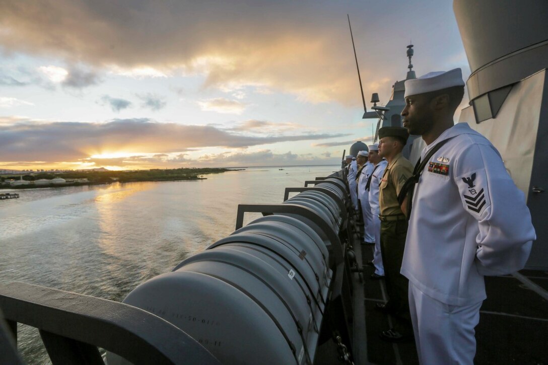 PEARL HARBOR, Hawaii (Dec. 6, 2015) U.S. Marines and Sailors man the rails as the USS Anchorage (LPD 23) pulls into port in Hawaii. Hawaii is the 15th Marine Expeditionary Unit’s last port call before heading home after their WESTPAC 15 deployment. (U.S. Marine Corps photo by Sgt. Jamean Berry/Released)