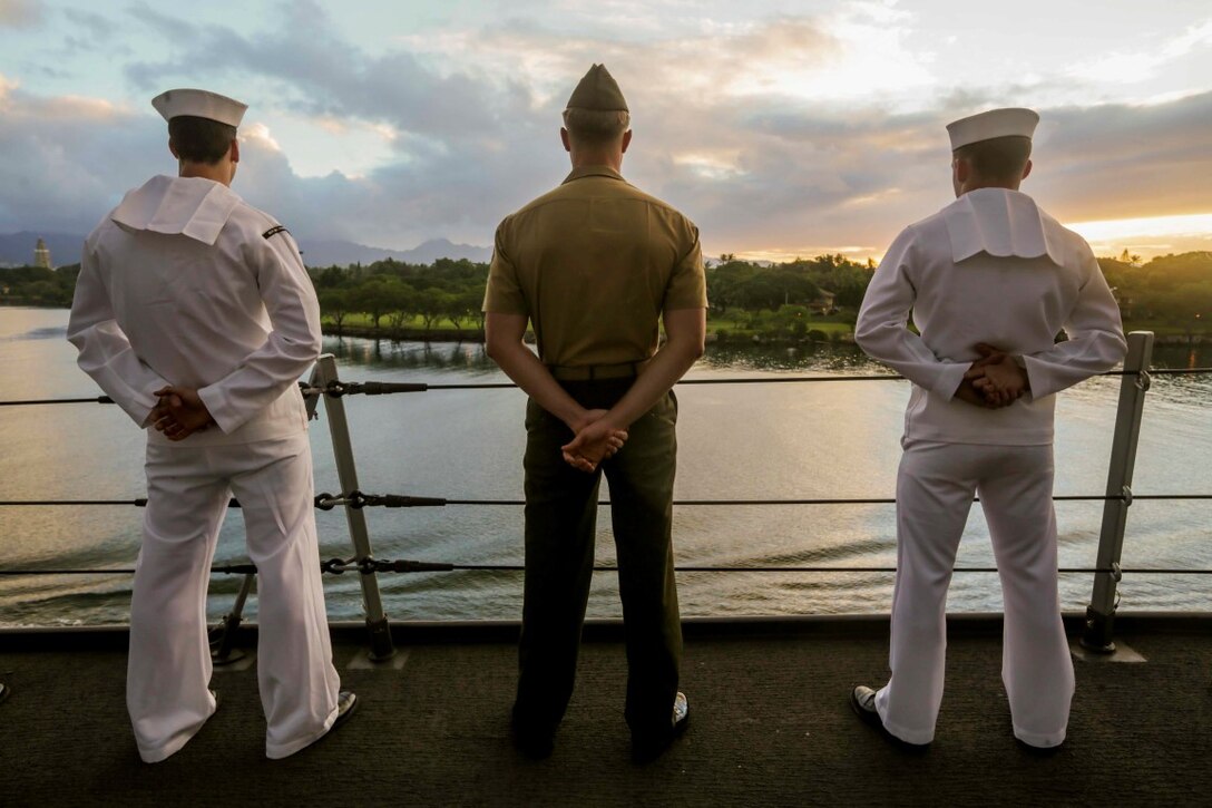 PEARL HARBOR, Hawaii (Dec. 6, 2015) U.S. Marines and Sailors man the rails as the USS Anchorage (LPD 23) pulls into port in Hawaii.  Hawaii is the 15th Marine Expeditionary Unit’s last port call before heading home after their WESTPAC 15 deployment. (U.S. Marine Corps photo by Sgt. Jamean Berry/Released)