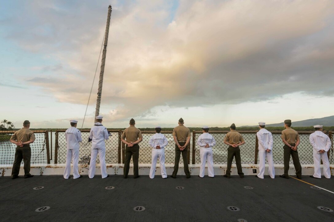 PEARL HARBOR, Hawaii (Dec. 6, 2015) U.S. Marines and Sailors man the rails as the USS Anchorage (LPD 23) pulls into port in Hawaii. Hawaii is the 15th Marine Expeditionary Unit’s last port call before heading home after their WESTPAC 15 deployment. (U.S. Marine Corps photo by Sgt. Jamean Berry/Released)