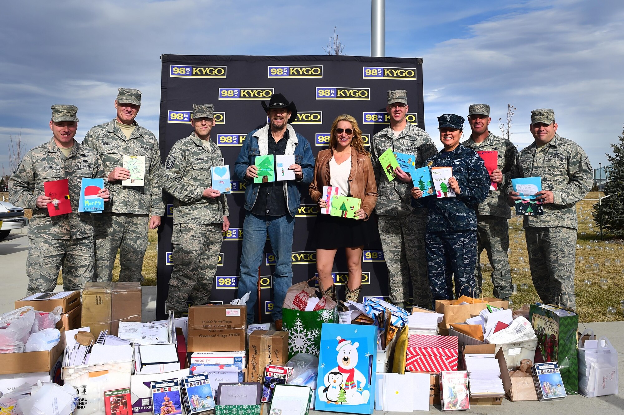 Master Sergeant Jessie Thomas, Air Reserve Personnel Center first sergeant, stands with the Buckley First Sergeants Council and members of Denver radio station 98.5 KYGO during a photo Dec. 9, 2015, at the Colorado Freedom Memorial in Aurora, Colo. (U.S. Air Force photo/Airman 1st Class Luke W. Nowakowski)