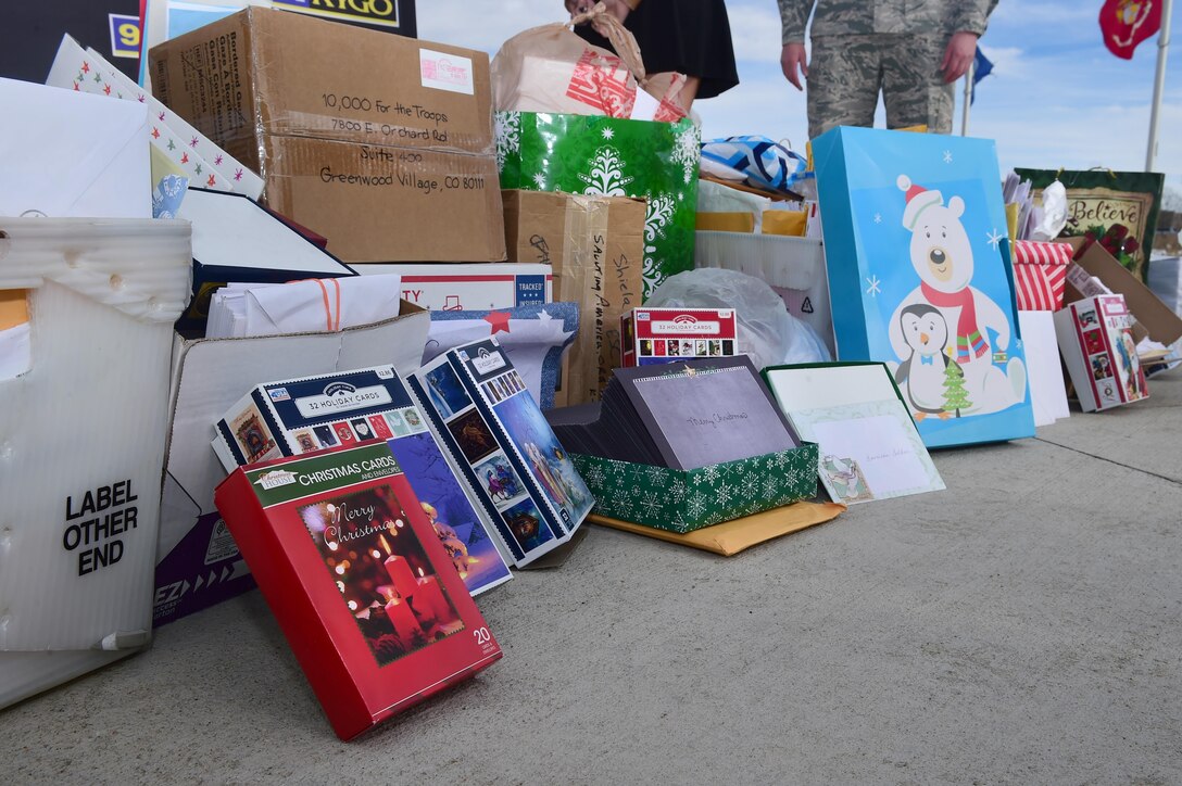 Holiday cards are displayed by Buckley First Sergeants Council members and members of Denver radio station 98.5 KYGO Dec. 9, 2015, at the Colorado Freedom Memorial in Aurora, Colo. In all, 13,872 cards were written by residents of Denver, which will be delivered to troops stationed abroad who will not be home for the holidays. (U.S. Air Force photo/Airman 1st Class Luke W. Nowakowski)